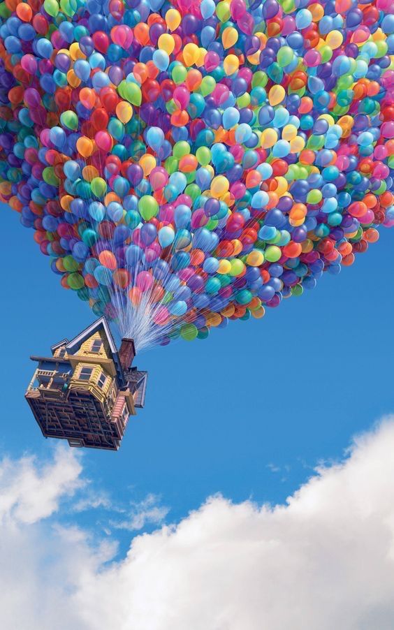 there is a house in the air with balloons