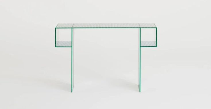 a glass and metal console table against a white background, with the top half covered in dots