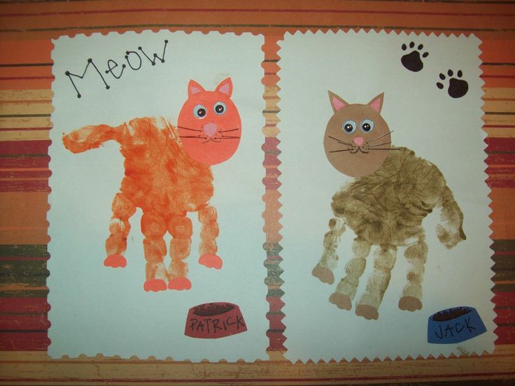 two handprints with cats and paw prints on them