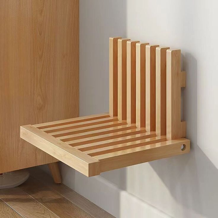 a wooden shelf sitting on the side of a wall