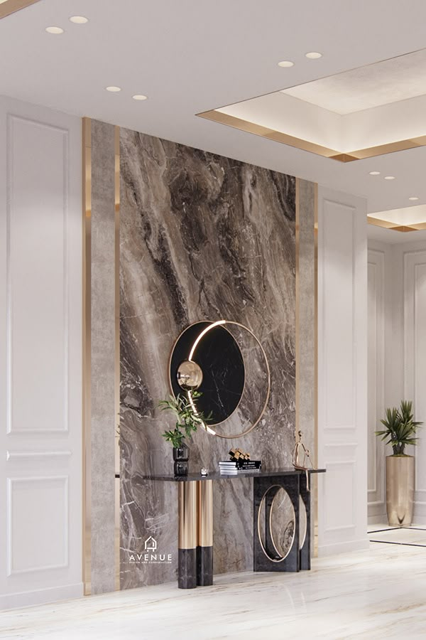 an elegant living room with marble walls and flooring