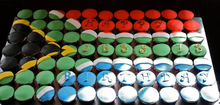 cupcakes are arranged in the shape of an american flag and numbers on top