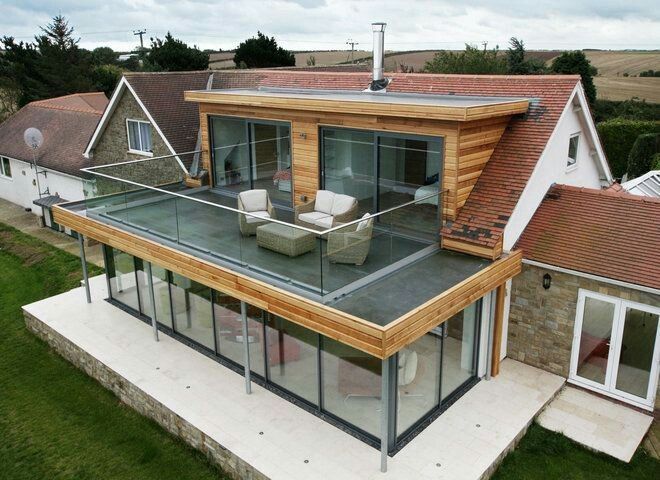 an aerial view of a house with large windows