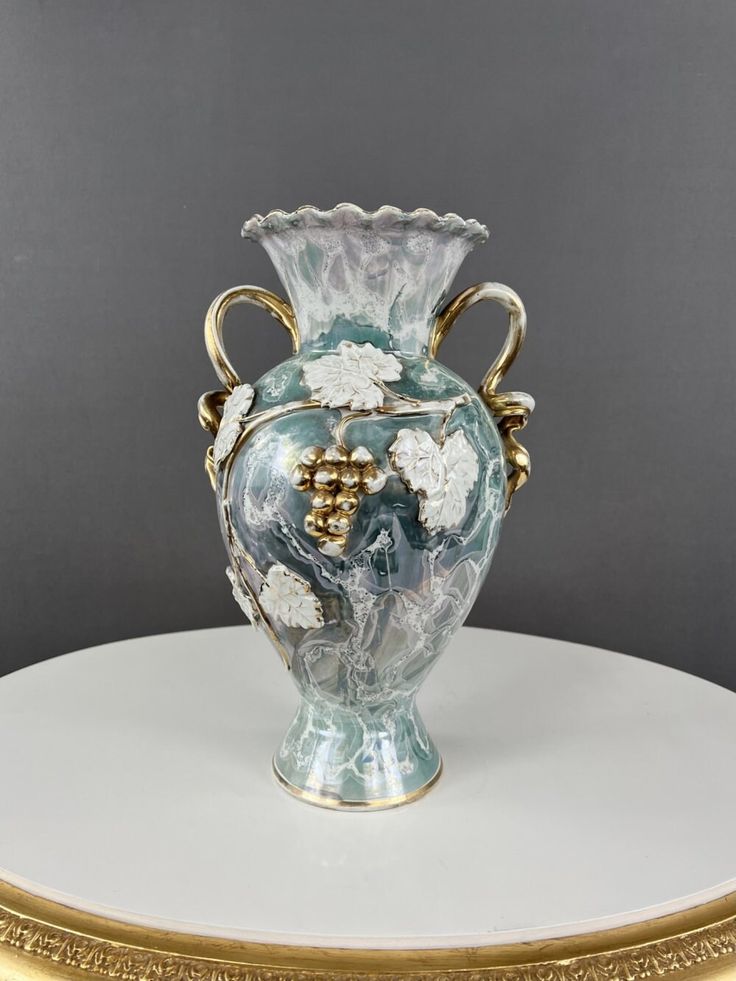 This vintage ceramic vase, hailing from the 20th century, is a delightful and versatile decor piece. Crafted from ceramic, it embodies the design aesthetics of its era, offering both functionality and aesthetic appeal. With dimensions of 36/22 cm, the vase strikes a balance between commanding presence and delicate proportions. The mid-20th century was marked by diverse design influences, and this vase might reflect the eclectic styles of that time. Ideal for collectors and those who appreciate t Aesthetic Vase, Victorian Vases, Vase Ideas, Fire Icons, Antique Vases, Vase Pottery, Historical Design, Design Aesthetics, Vase Flower