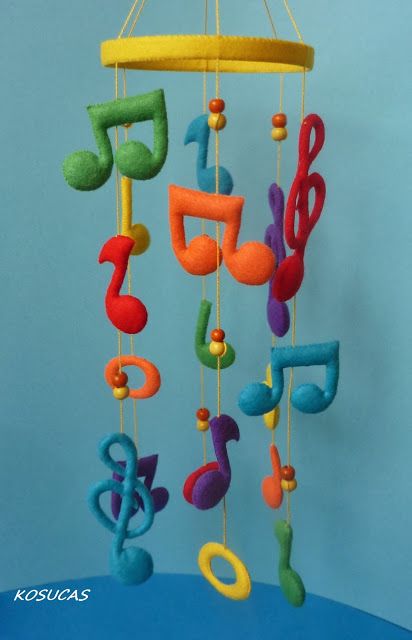 a mobile with musical notes hanging from it