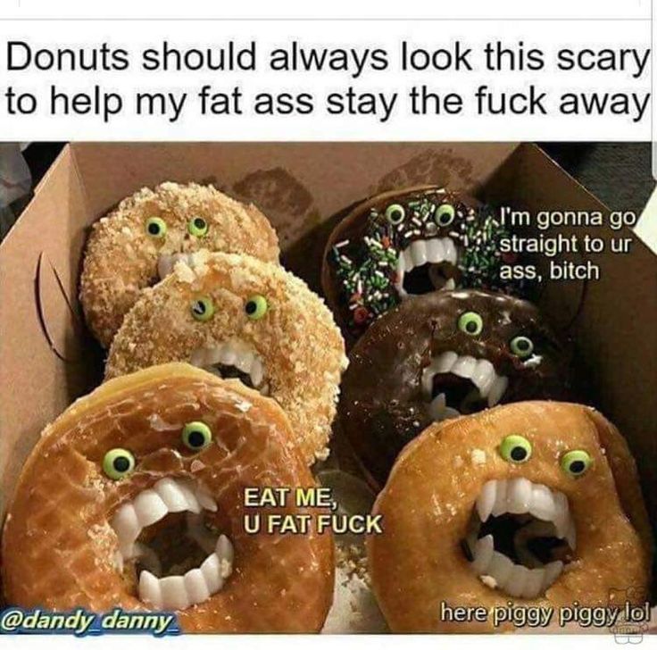 a box filled with donuts covered in different types of doughnuts and eyes