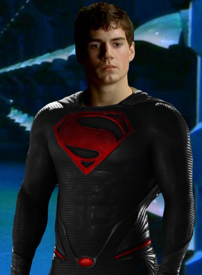 a young man in a superman suit standing with his hands on his hips