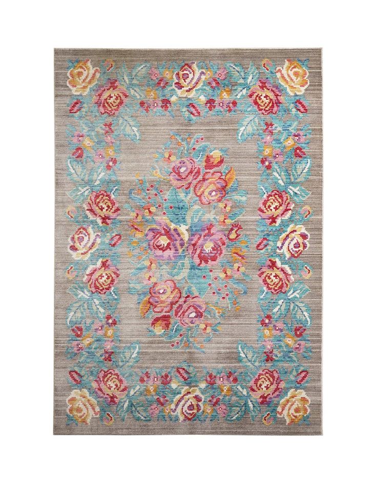 an area rug with flowers and leaves on the front in blue, pink, yellow and orange