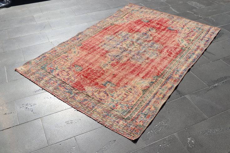 an old rug is laying on the ground