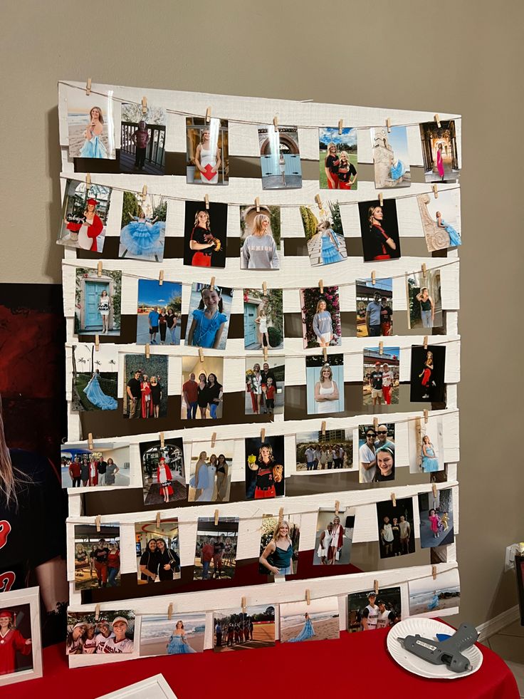 a table with pictures and magnets on it next to a red table cloth covered table