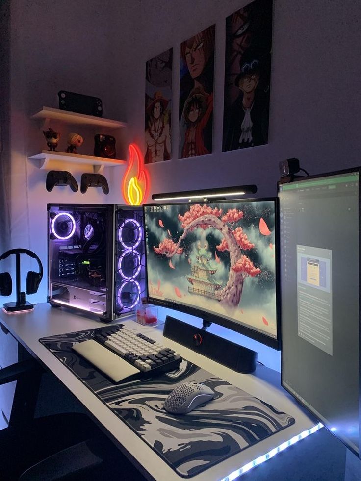 three computer monitors sitting on top of a desk next to a keyboard and monitor screen