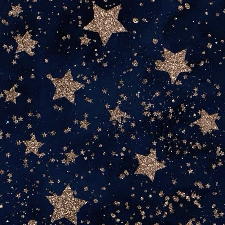 gold stars on a dark blue background with white and silver glitters in the middle