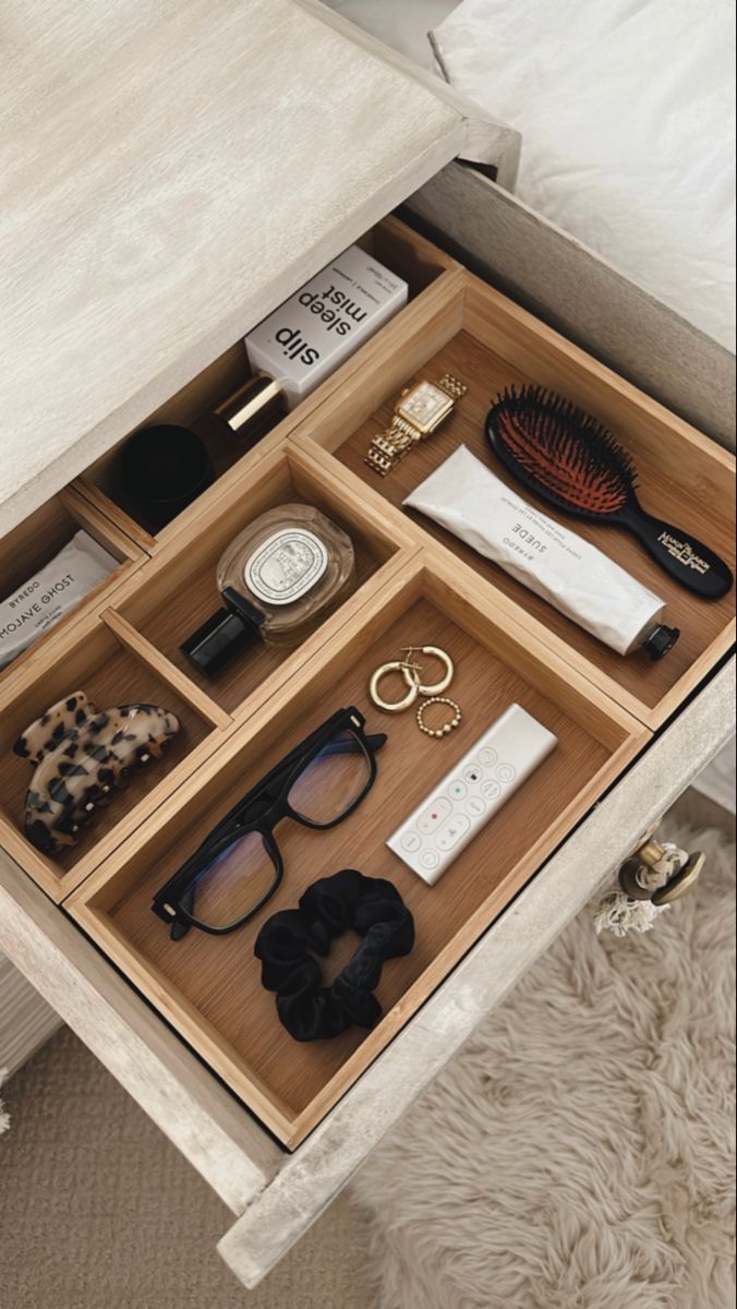 an open drawer with various items in it