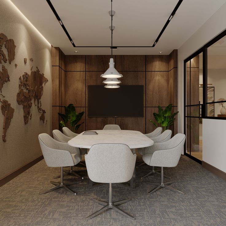 a large white table surrounded by chairs in a room with a world map on the wall