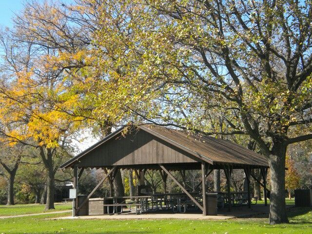 a picnic pavilion in the middle of a park