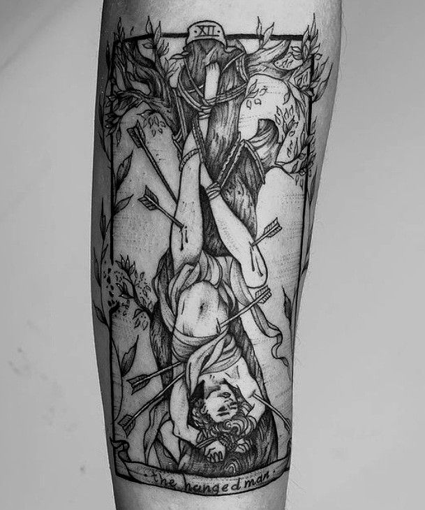 a black and white photo of a tattoo on the leg