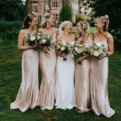 a group of women standing next to each other on top of a lush green field