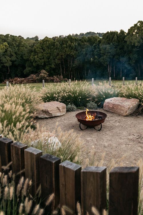 a fire pit in the middle of a field