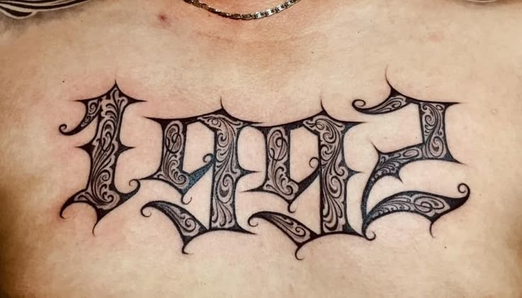 a chest tattoo with the word evil on it