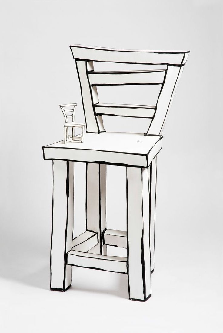 a small white table with a glass on it