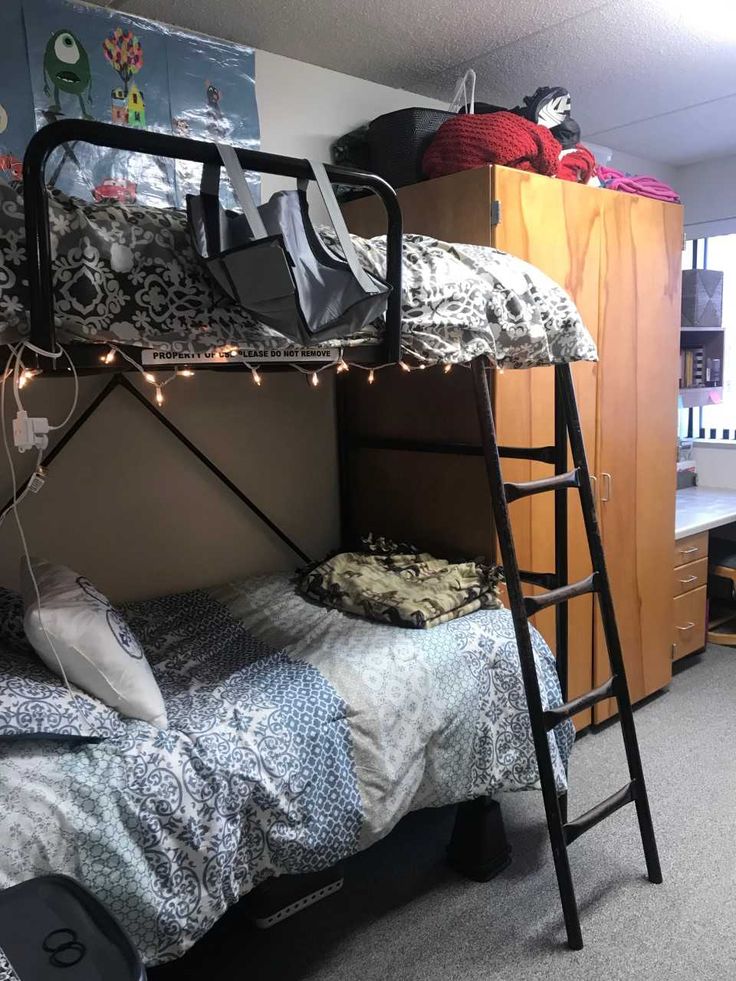 a bunk bed in a dorm room with lights on