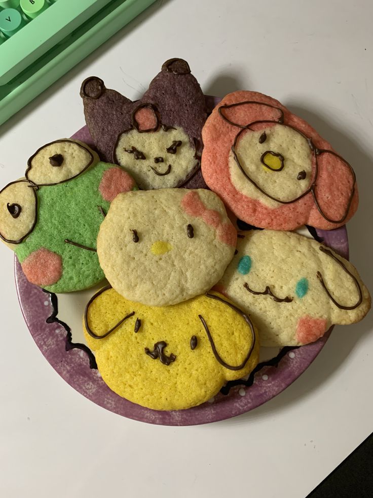 there are some cookies that look like animals on the plate