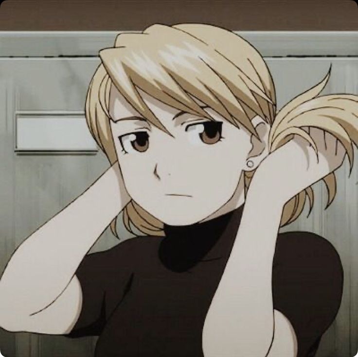 an anime character with blonde hair holding her hand to her head