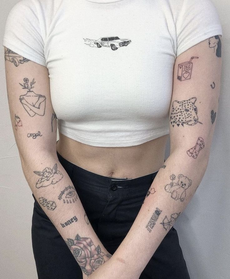 a woman with many tattoos on her arms