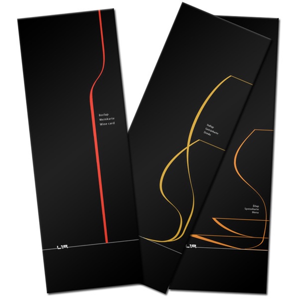 two black folders with red and yellow lines on them, one in the shape of a curve