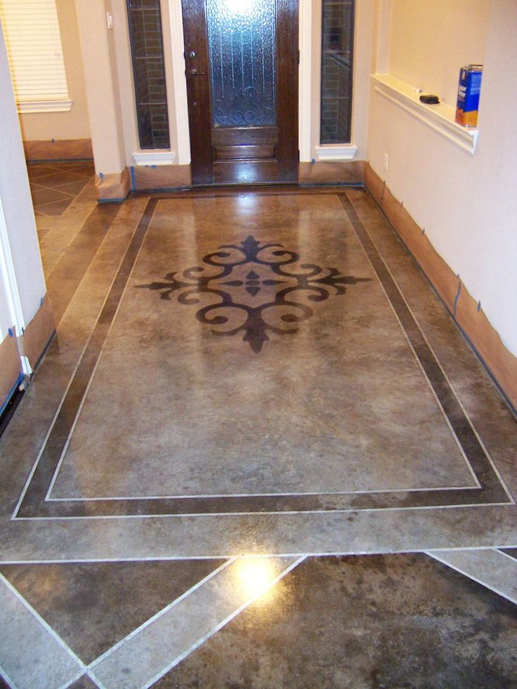 an entryway with a door and tile flooring in the hallway, leading to another room