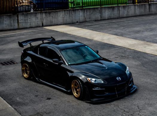 a black sports car parked on the side of the road