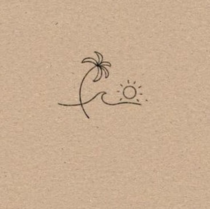 a drawing of a palm tree and the sun on a piece of brown paper with black ink