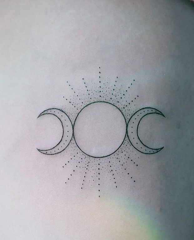 three phases of the sun and moon tattoo design on side ribcage or back