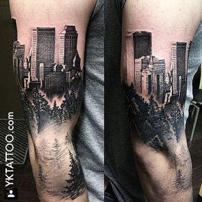 a man with a tattoo on his arm that has a cityscape in it