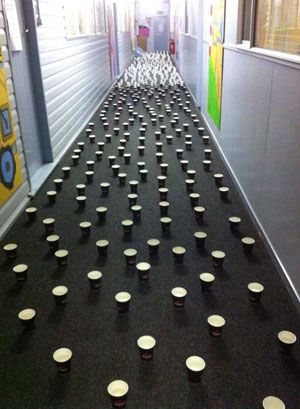 rows of cupcakes are lined up on the floor