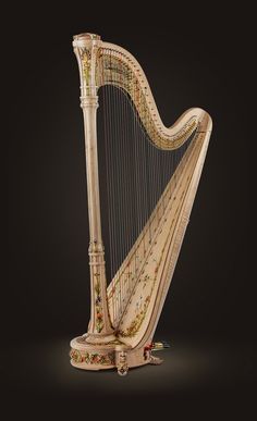 an ornately decorated harp on a black background