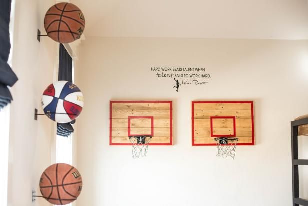 the basketballs are hanging on the wall in the room