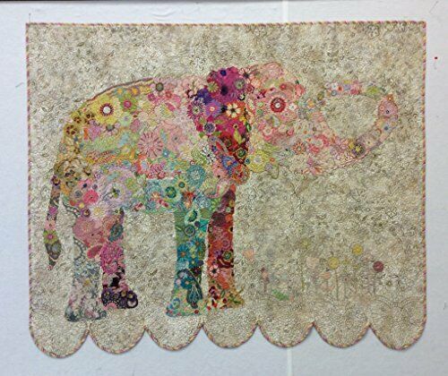 an elephant made out of fabric with flowers on it