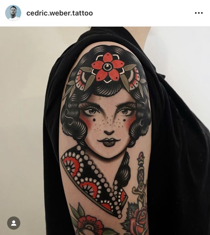 a woman's face with red flowers on her head is shown in this tattoo design