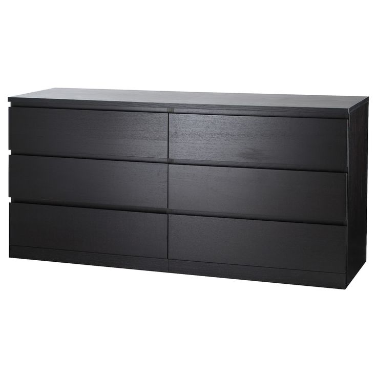 a black dresser with four drawers and two doors