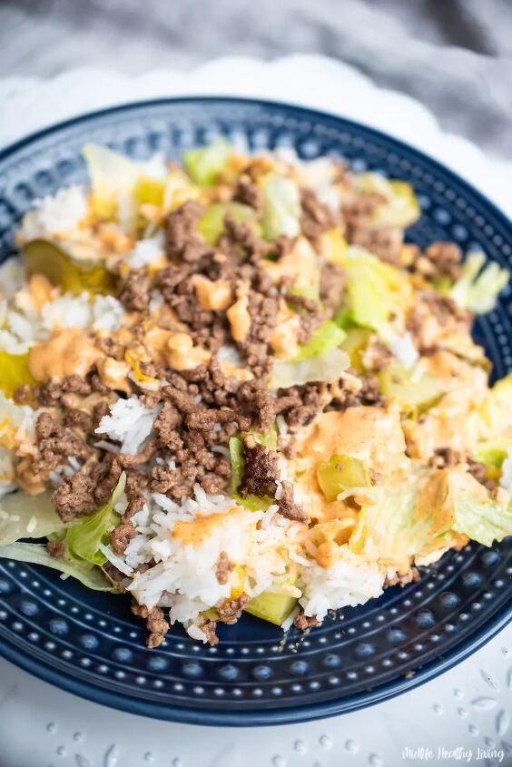 a close up of a plate of food with meat and rice on it's side