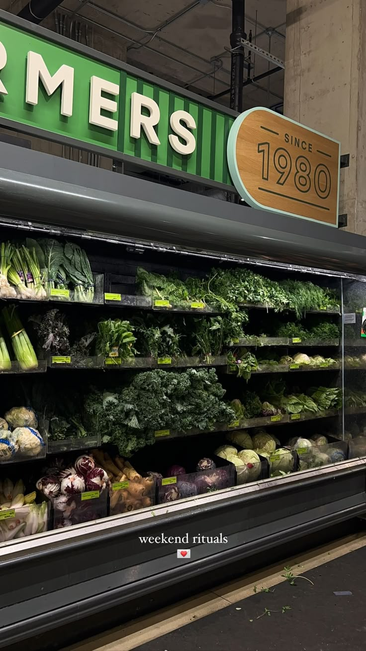 the produce section of a grocery store with fresh fruits and vegetables