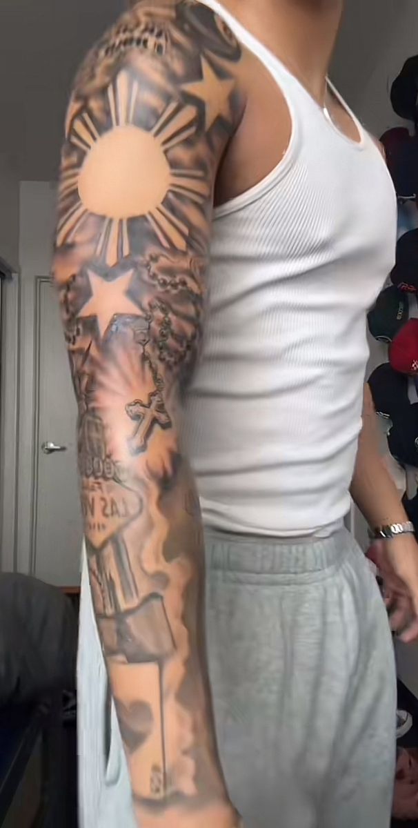 a man with a tattoo on his arm