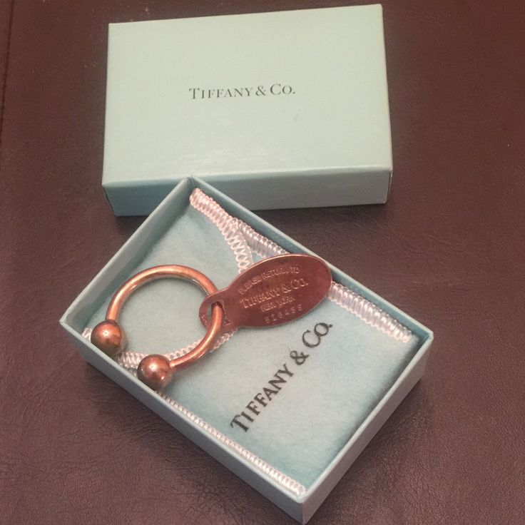 Tiffany & Co. Sterling Please Return To Key Ring With Original Box And Blue Pouch. Marked Tiffany & Co. 925 Sterling. 2001. 518435. Perfect Condition. Really Nice! Tiffany Key Ring, Return To Tiffany Ring Sterling Silver, Tiffany And Co Hardware Collection, Tiffany Blue Key Necklace, Tiffany And Co 1837 Ring, Key Card Holder, Tiffany & Co., Phone Ring, Key Rings