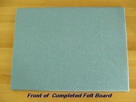 the front of a folded felt board on top of a wooden table with text that reads front of completed felt board