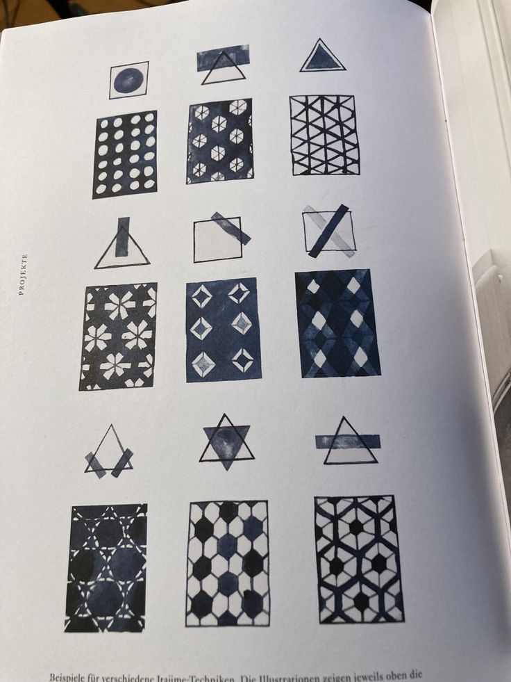 an open book with different designs on it's pages, including squares and rectangles