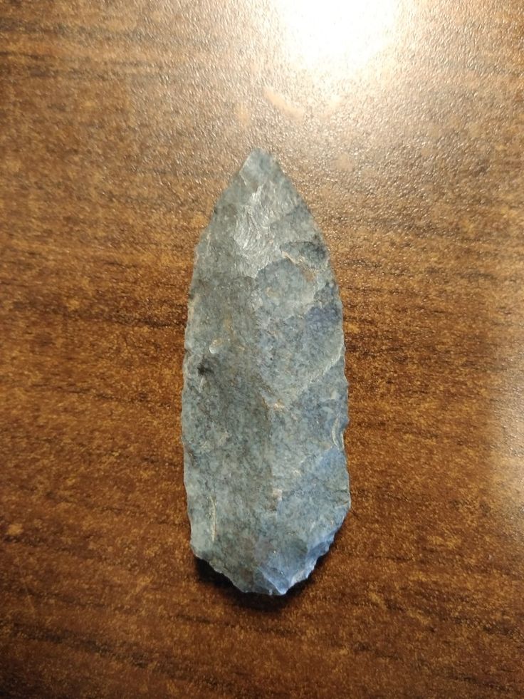 a piece of rock sitting on top of a wooden table