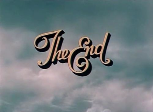 the end logo on a stained glass window