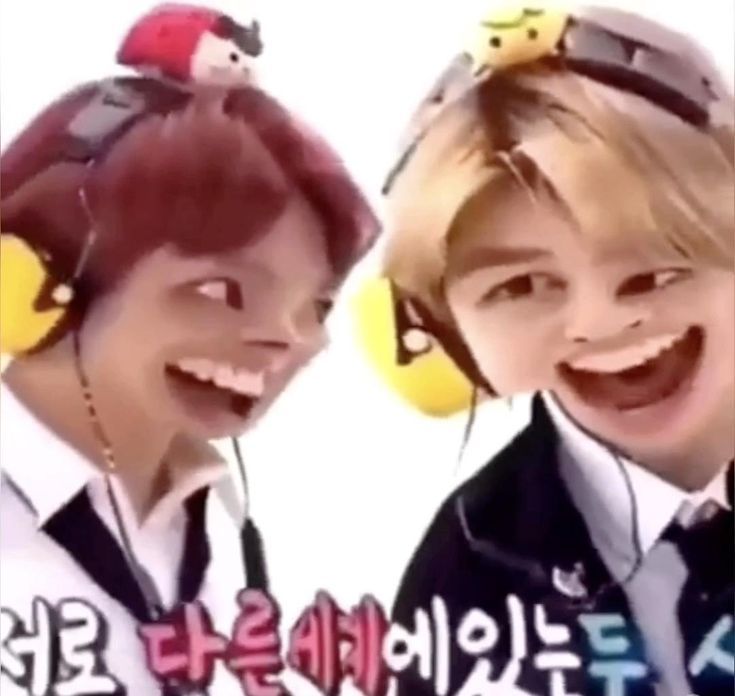 two young boys wearing headphones and smiling at the camera with words written in korean