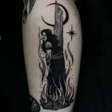 a person with a tattoo on their leg